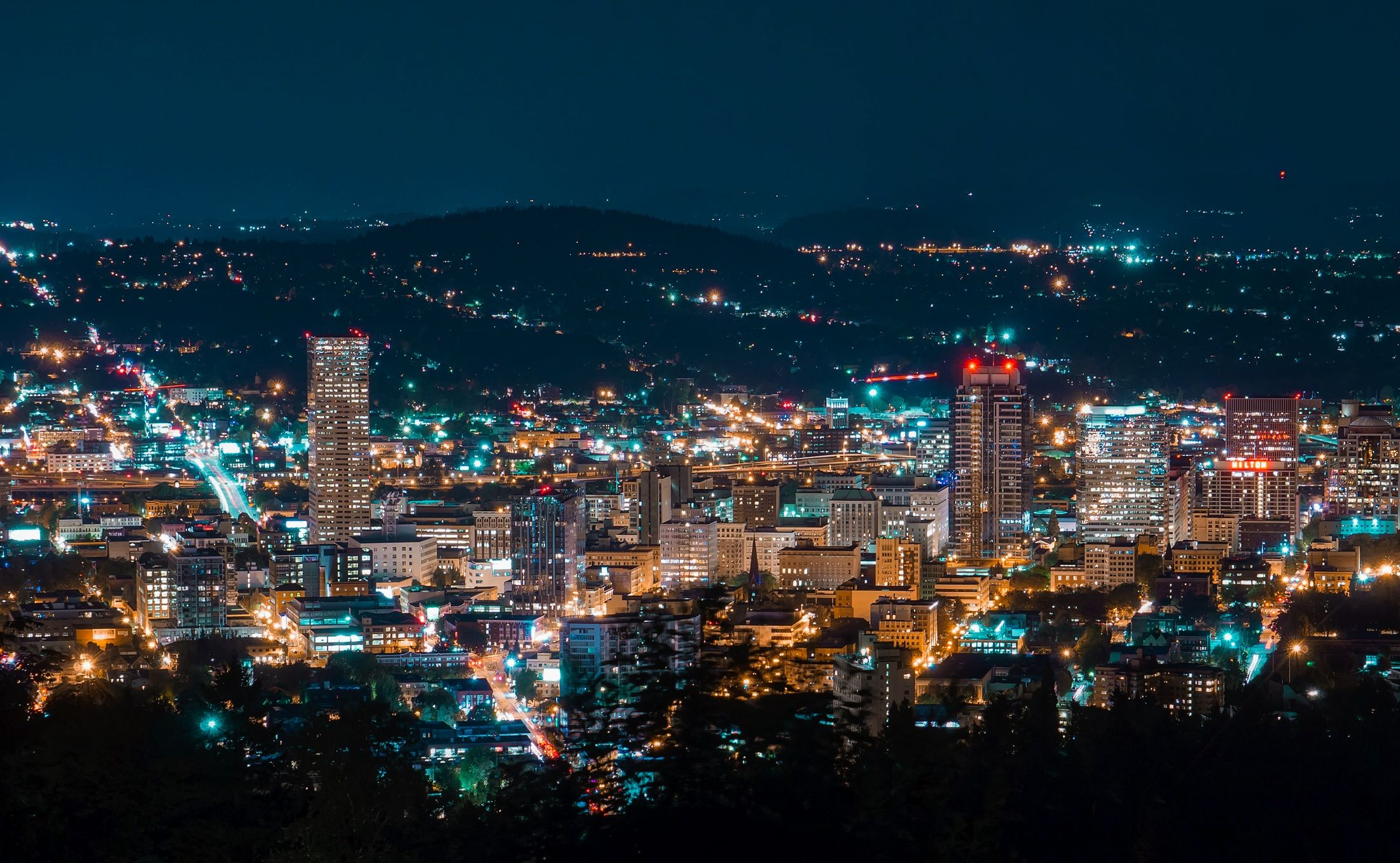 A city skyline brightly lit at night